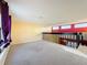 Bright loft area with neutral walls and carpet flooring at 4818 Marks Ter # 385 B2, Orlando, FL 32811