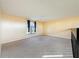 Spacious loft bedroom with carpet, window, and neutral walls at 4818 Marks Ter # 385 B2, Orlando, FL 32811