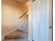 Carpeted staircase with a closet and a tiled floor at 4818 Marks Ter # 385 B2, Orlando, FL 32811