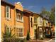 Attractive row of townhouses with Spanish-style architecture at 5112 Conroy Rd # 13, Orlando, FL 32811