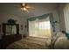 Bedroom with water view and sliding glass doors at 560 Eden Dr, St Cloud, FL 34771