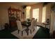 Elegant dining room with a large table, six chairs, and a wooden hutch at 560 Eden Dr, St Cloud, FL 34771