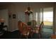 Casual dining area with wicker chairs and a glass top table next to a window at 560 Eden Dr, St Cloud, FL 34771