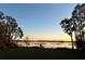 Scenic sunset view over calm lake waters at 560 Eden Dr, St Cloud, FL 34771