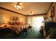 Large main bedroom with king-size bed and sliding doors leading to a patio at 560 Eden Dr, St Cloud, FL 34771