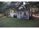 Gray shed and white storage building in backyard at 560 Eden Dr, St Cloud, FL 34771