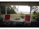 Screened porch with fire pit and water view at 560 Eden Dr, St Cloud, FL 34771