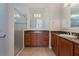 Bathroom with shower and granite vanity at 560 Presido Park Pl, Kissimmee, FL 34759