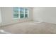 Spacious bedroom with neutral carpeting and large window at 560 Presido Park Pl, Kissimmee, FL 34759