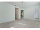 Primary bedroom with carpet and access to bathroom and other rooms at 560 Presido Park Pl, Kissimmee, FL 34759