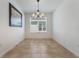 Bright dining area with a chandelier and large window at 560 Presido Park Pl, Kissimmee, FL 34759