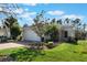 Single-story house with a stone facade and two-car garage at 560 Presido Park Pl, Kissimmee, FL 34759