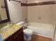 Bathroom with granite vanity, glass sink, and a tub shower at 6106 Westgate Dr # 103, Orlando, FL 32835