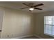 Bedroom with ceiling fan and window with blinds at 6106 Westgate Dr # 103, Orlando, FL 32835