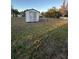 Large backyard with shed and grassy area at 6133 Olympic Ct, Orlando, FL 32808