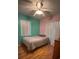 Bedroom with wood floors and ceiling fan at 6133 Olympic Ct, Orlando, FL 32808