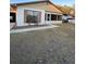 House exterior view, featuring a yard and driveway at 6133 Olympic Ct, Orlando, FL 32808