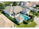 Aerial view of house with pool and backyard at 6228 Lecco Way, Windermere, FL 34786