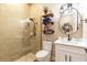 Small bathroom with a shower, toilet and white vanity at 6228 Lecco Way, Windermere, FL 34786