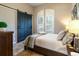 Guest bedroom with a queen-size bed and barn door at 6228 Lecco Way, Windermere, FL 34786