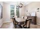 Bright dining room with a large wooden table and six chairs at 6228 Lecco Way, Windermere, FL 34786