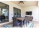 Spacious outdoor dining area with seating for eight at 6228 Lecco Way, Windermere, FL 34786