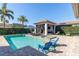 Resort-style pool with spa, covered patio, and lounge chairs at 6228 Lecco Way, Windermere, FL 34786