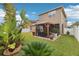Spacious backyard with a pergola, lush landscaping, and two-story home at 648 Cortona Dr, Orlando, FL 32828