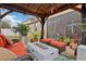 Relaxing covered patio with seating area and fire pit at 648 Cortona Dr, Orlando, FL 32828