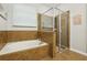 Bathroom with soaking tub and walk-in shower at 648 Cortona Dr, Orlando, FL 32828