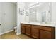 Clean bathroom with double vanity, large mirror, and tiled floor at 648 Cortona Dr, Orlando, FL 32828