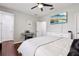 Bedroom with white bed frame, hardwood floors, and mounted TV at 648 Cortona Dr, Orlando, FL 32828