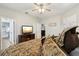 Primary bedroom with king-size bed, TV, and views of other rooms at 648 Cortona Dr, Orlando, FL 32828