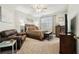 Bedroom with a small loveseat and a view of another room at 648 Cortona Dr, Orlando, FL 32828