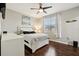 Bedroom with white bed frame and dark hardwood floors at 648 Cortona Dr, Orlando, FL 32828