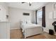 Bedroom with a full-size bed, dresser, and window with curtains at 648 Cortona Dr, Orlando, FL 32828