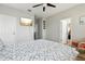Spacious bedroom with large bed, TV, and access to other rooms at 648 Cortona Dr, Orlando, FL 32828