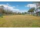 Community dog park with benches and grassy area for pets at 648 Cortona Dr, Orlando, FL 32828