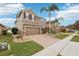 Two-story house with brown exterior, brick driveway, and landscaping at 648 Cortona Dr, Orlando, FL 32828