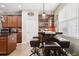 Kitchen breakfast bar with seating for four and a built-in shelving unit at 648 Cortona Dr, Orlando, FL 32828