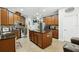 Island kitchen with granite countertops, stainless steel appliances, and ample cabinetry at 648 Cortona Dr, Orlando, FL 32828