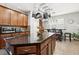 Eat-in kitchen with large island, granite countertops and stainless steel appliances at 648 Cortona Dr, Orlando, FL 32828