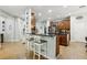 Kitchen boasts a large island with seating, ample cabinetry, and stainless steel appliances at 648 Cortona Dr, Orlando, FL 32828