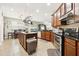 Open kitchen with island, double ovens, pot rack, and ample counter space at 648 Cortona Dr, Orlando, FL 32828