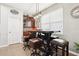 Kitchen breakfast bar with seating for four and a built-in shelving unit at 648 Cortona Dr, Orlando, FL 32828