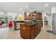 Open kitchen features an island with granite countertops and a large pantry at 648 Cortona Dr, Orlando, FL 32828
