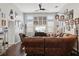 Bright living room with hardwood floors and a comfortable leather sectional sofa at 648 Cortona Dr, Orlando, FL 32828