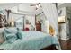 Main bedroom with canopy bed, hardwood floors, and ensuite bathroom access at 648 Cortona Dr, Orlando, FL 32828
