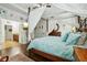 Main bedroom with king-size bed, hardwood floors, and ensuite bathroom at 648 Cortona Dr, Orlando, FL 32828