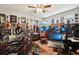 Dedicated music studio featuring a drum kit, guitars, and recording technology at 648 Cortona Dr, Orlando, FL 32828